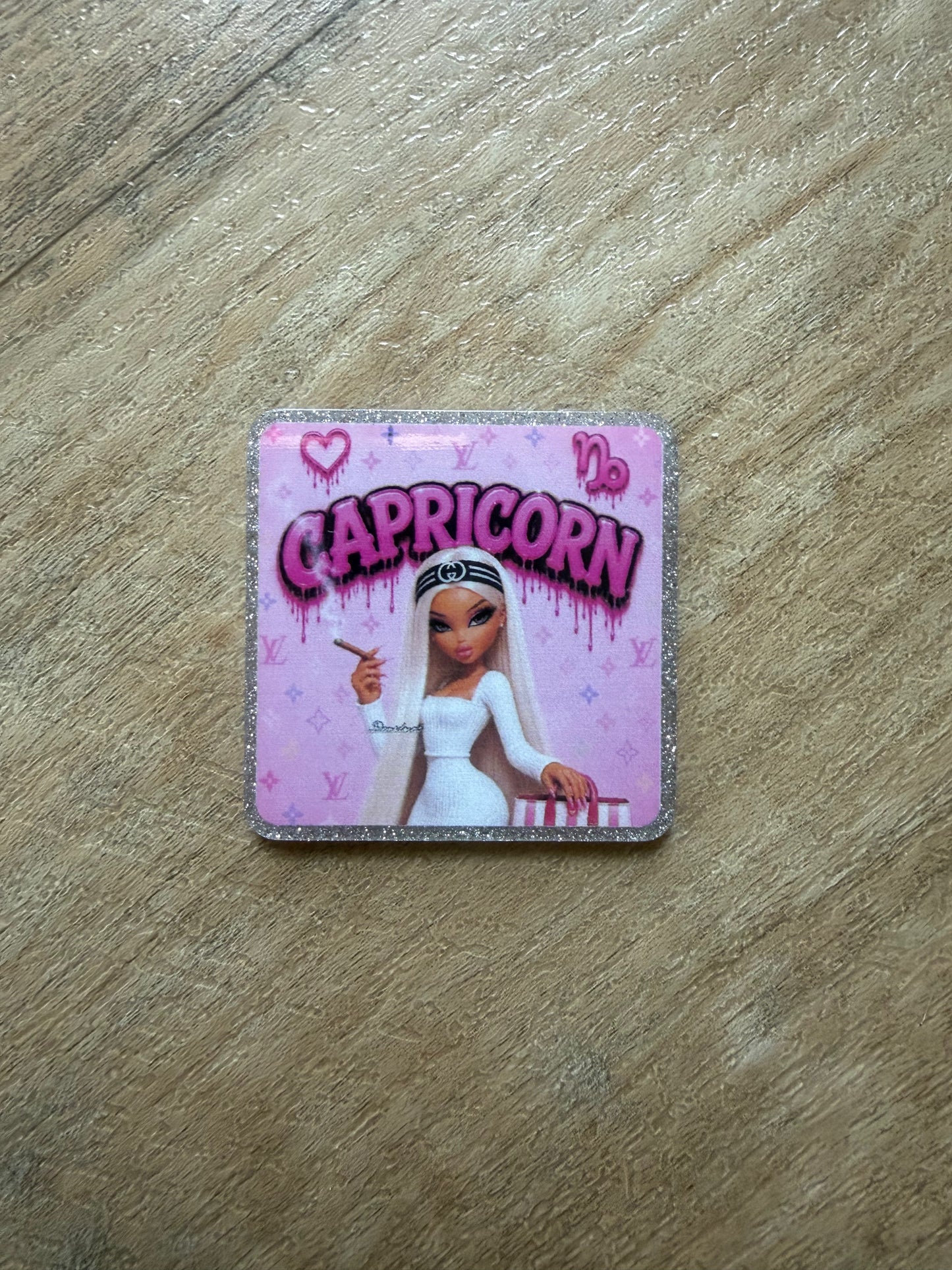 Capricorn badge reel