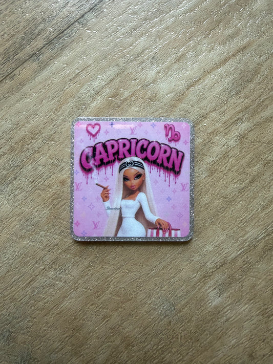 Capricorn badge reel