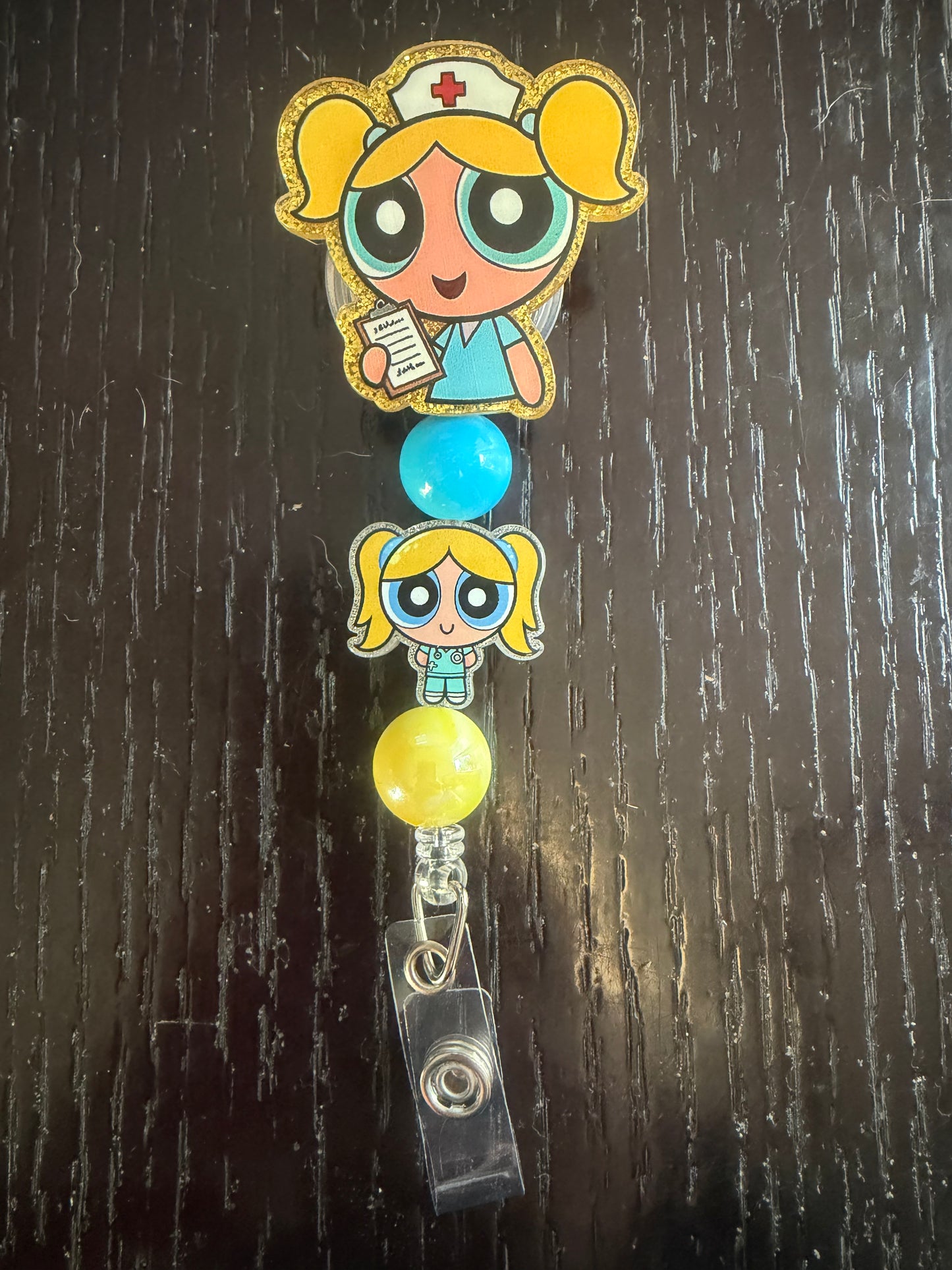 PPG nurse Bubbles badge reel