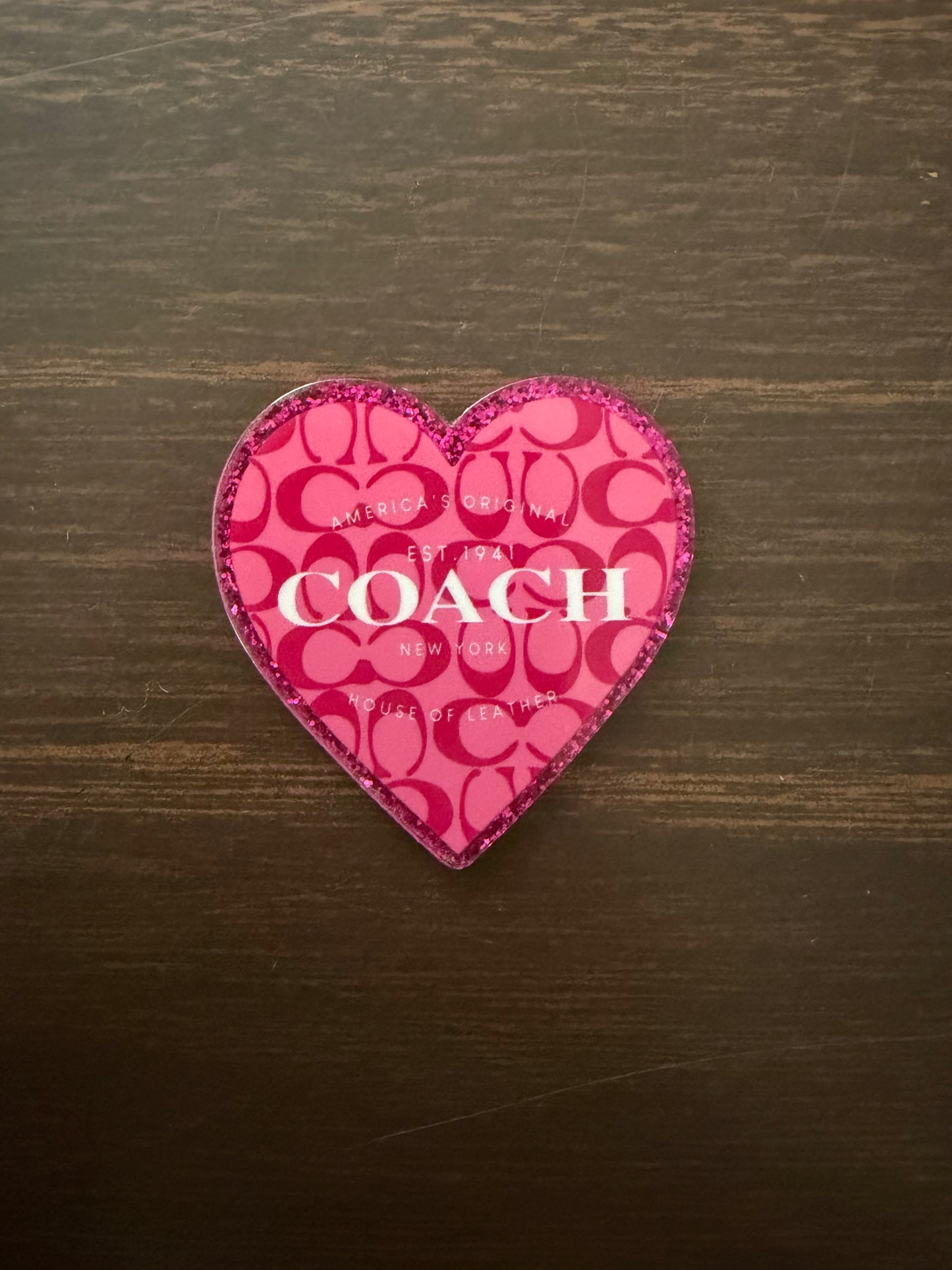 Coach badge reel