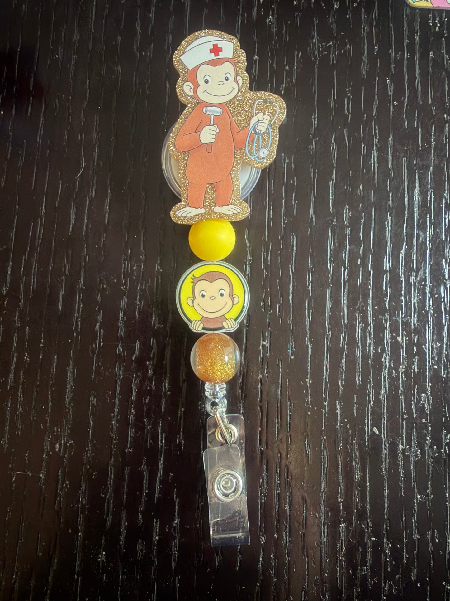 Curious George badge reel
