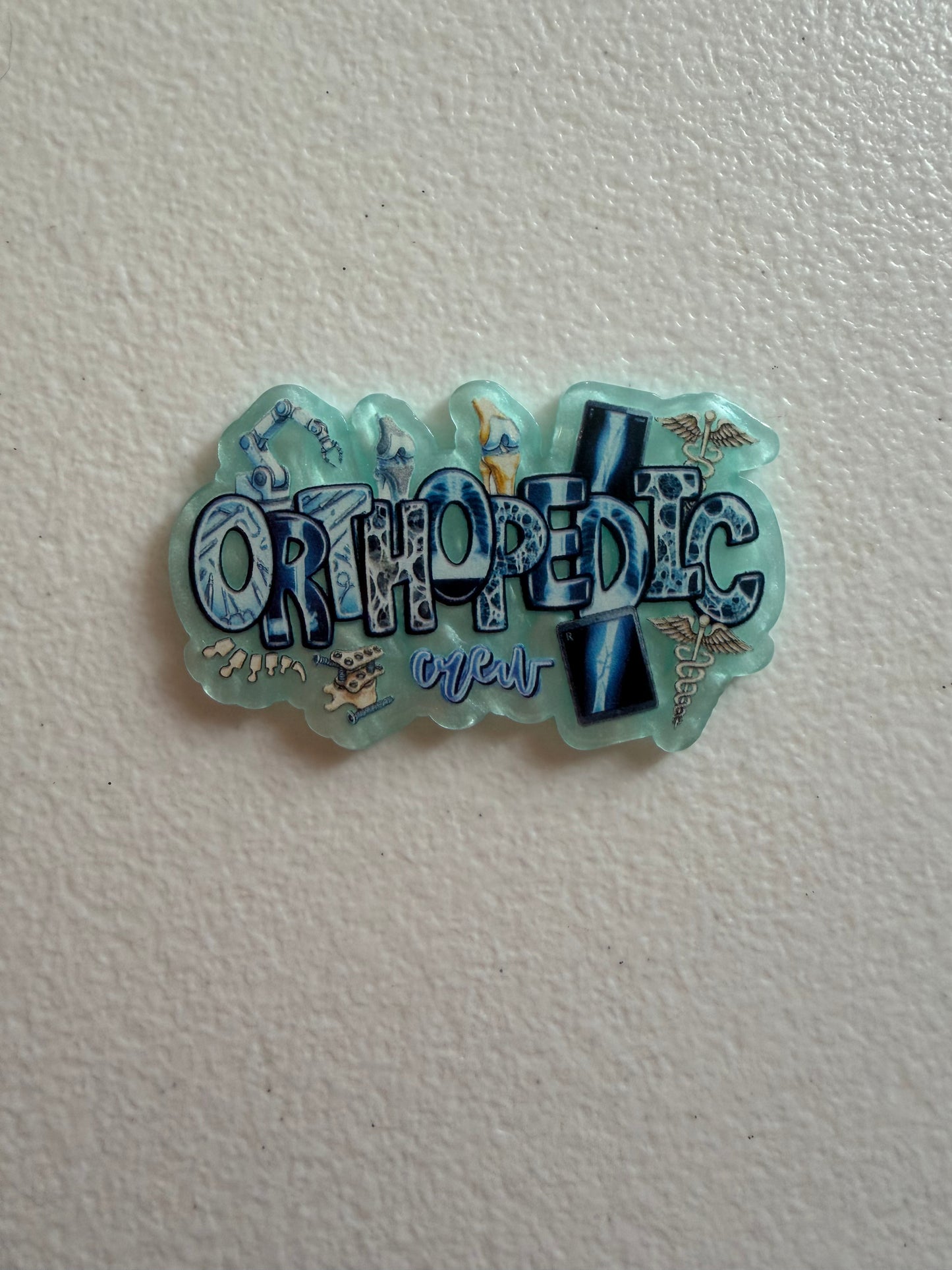Orthopedic crew badge reel