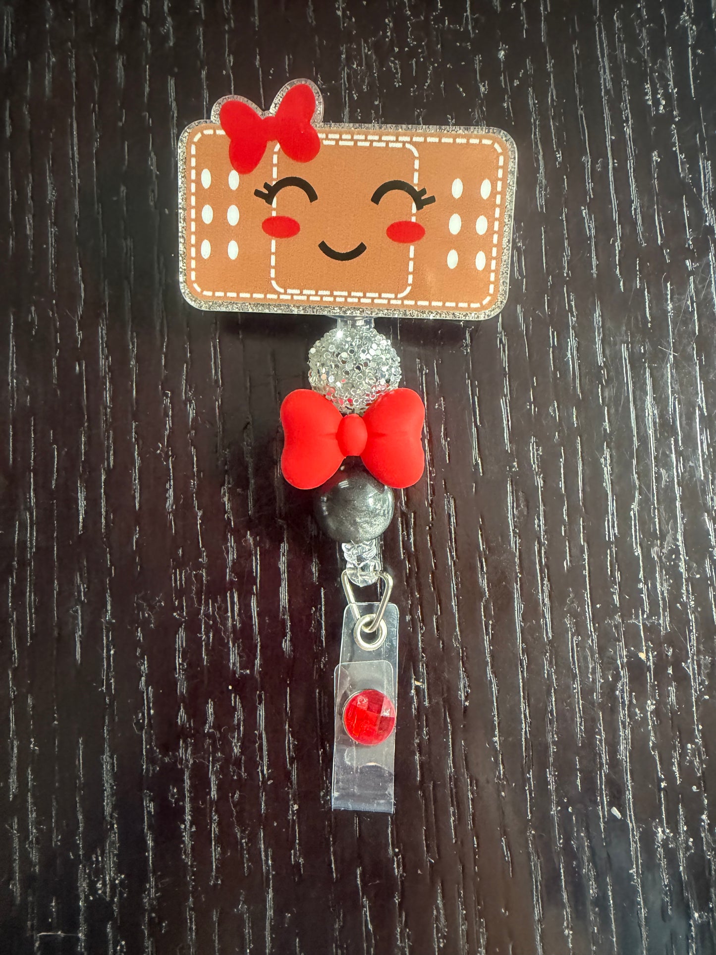 Bandaid badge reel