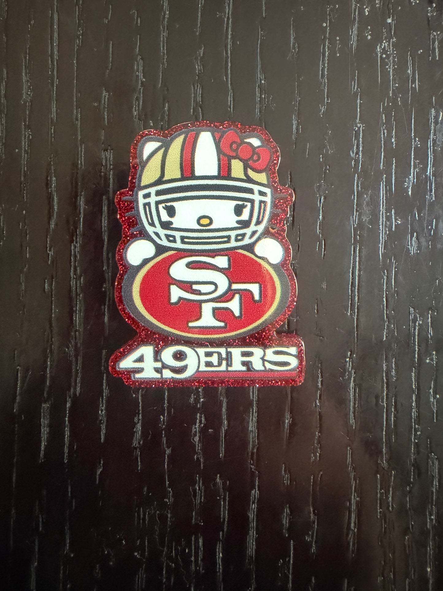 49ers Hello Kitty badge reel