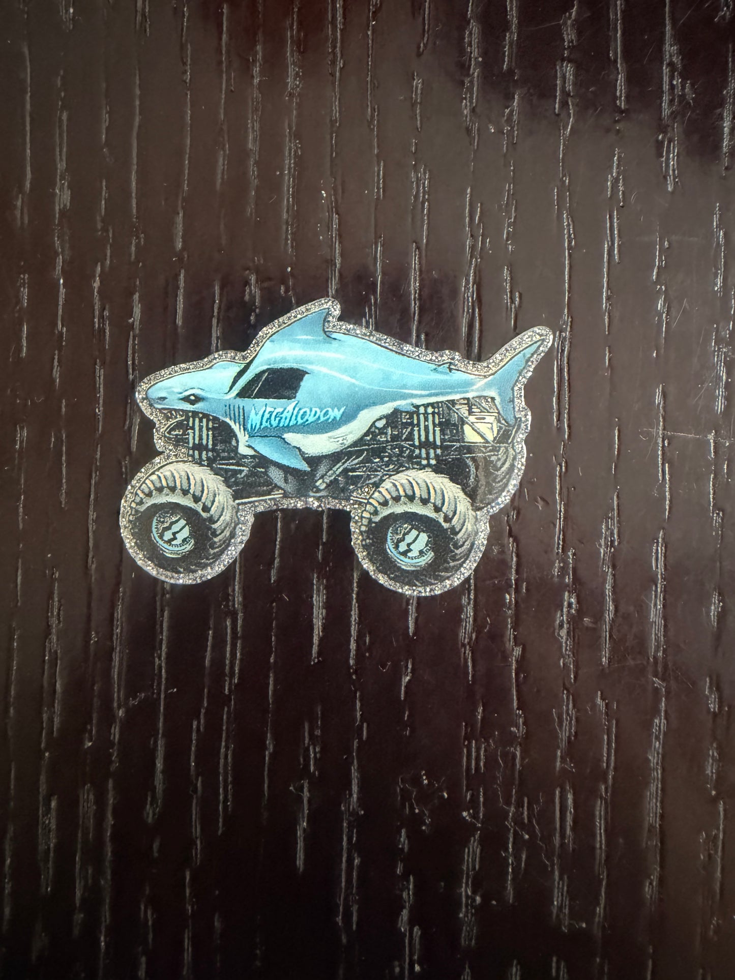 Megalodon monster truck badge reel
