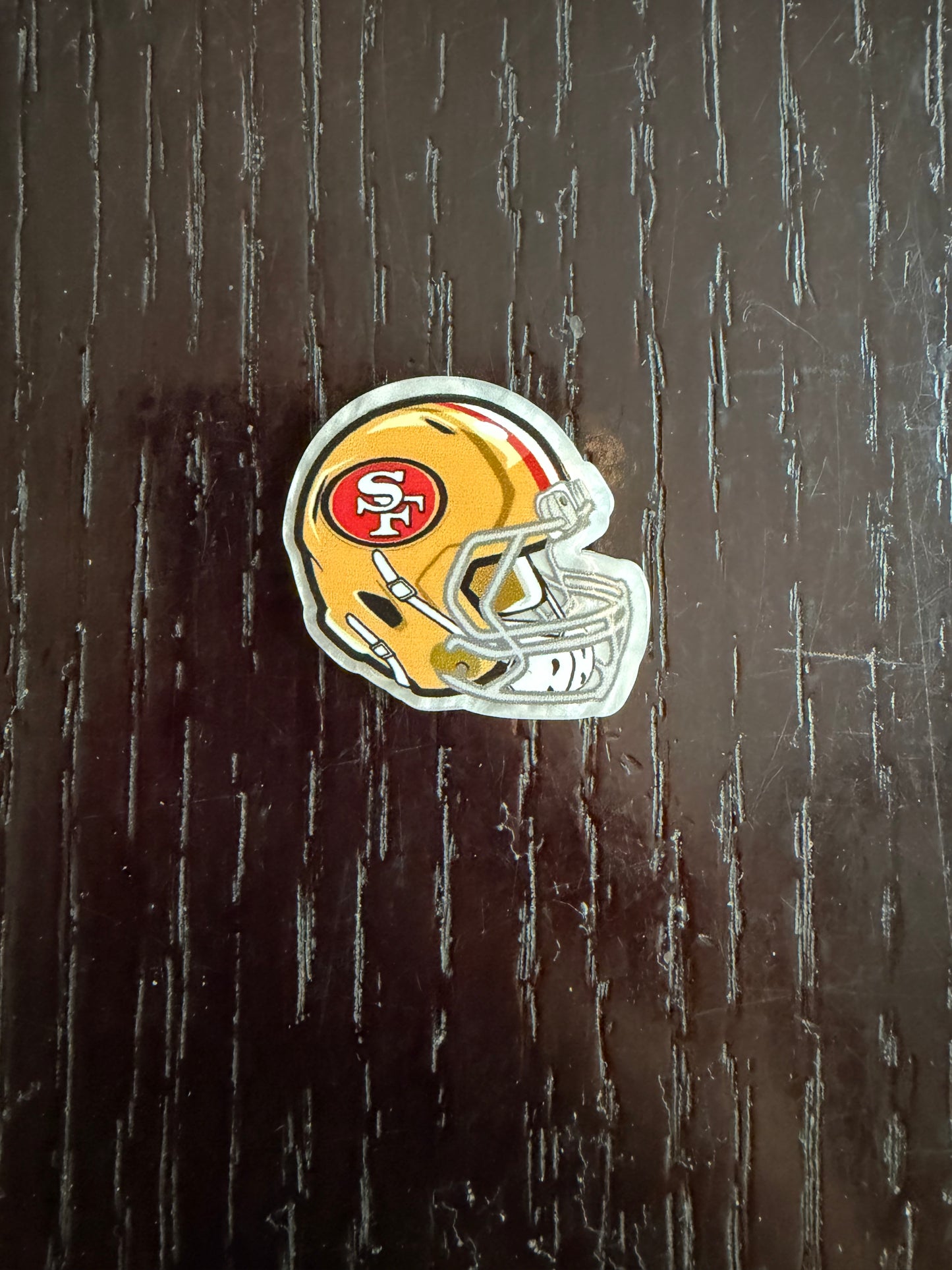 2. ADD A FOOTBALL HELMET CHARM