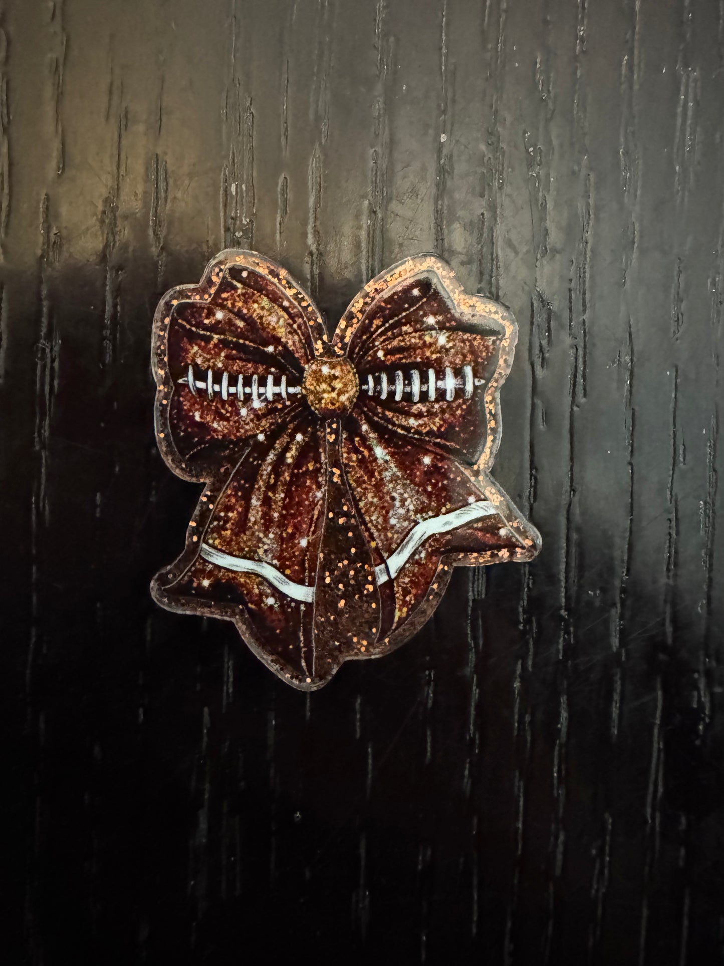 Football bow badge reel