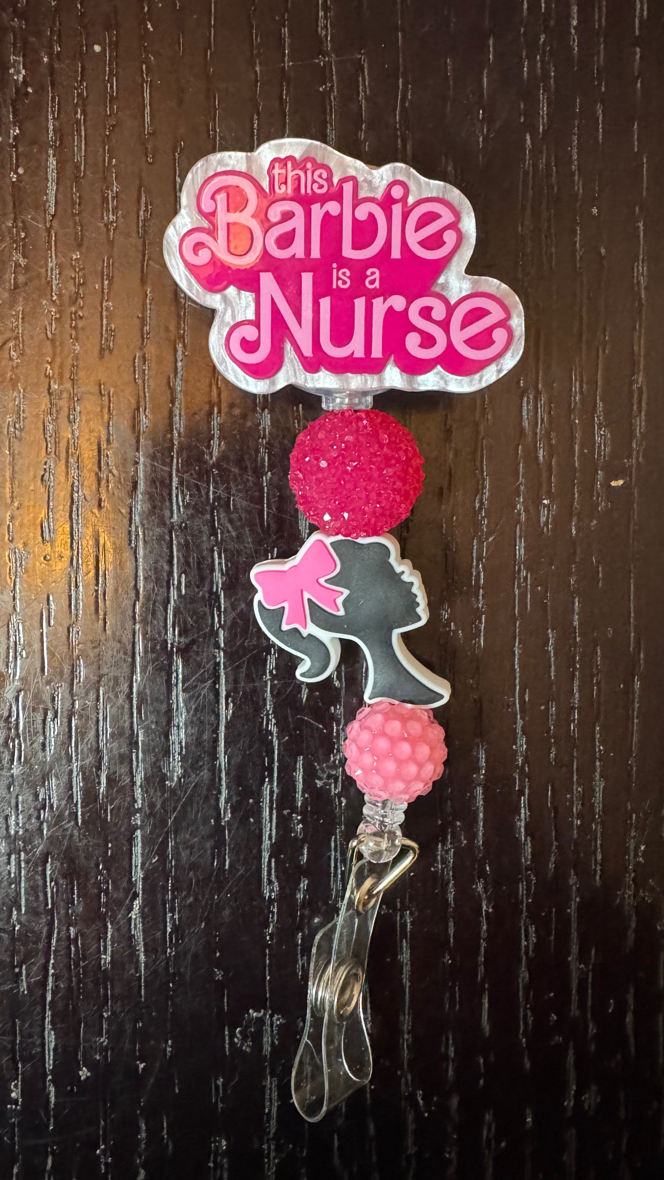 This Barbie is a nurse badge reel